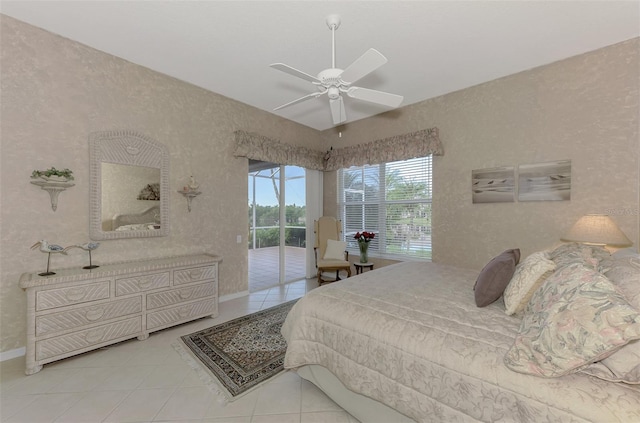 bedroom with access to outside, ceiling fan, and tile patterned flooring