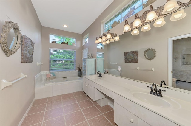 bathroom with tile patterned flooring, vanity, and shower with separate bathtub