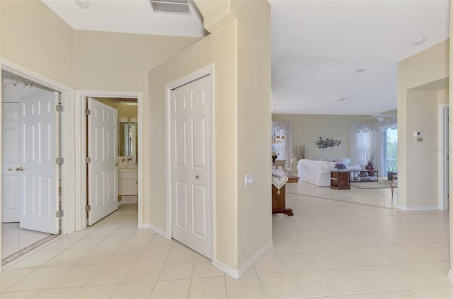 hallway featuring light tile patterned flooring