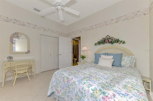 bedroom with light tile patterned floors, ceiling fan, and a closet