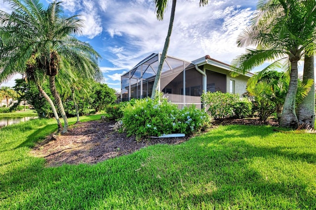 view of yard featuring a lanai