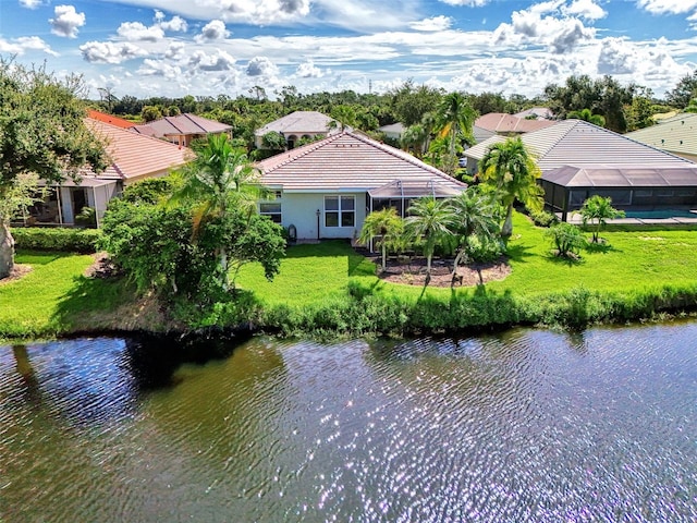 birds eye view of property with a water view