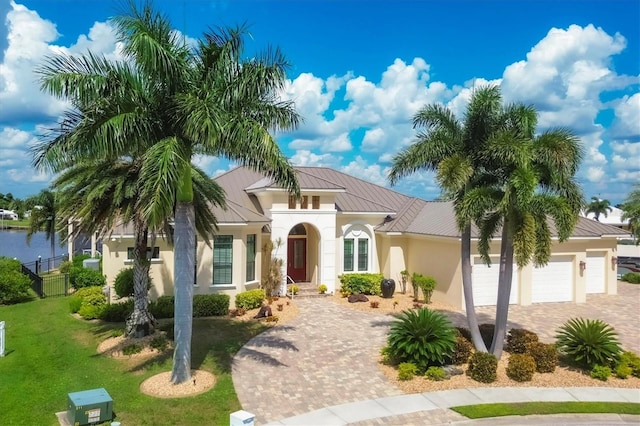 mediterranean / spanish-style house with a front lawn