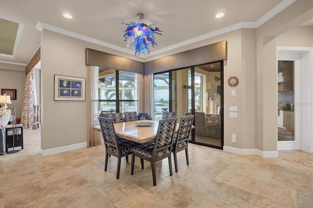 dining space with crown molding