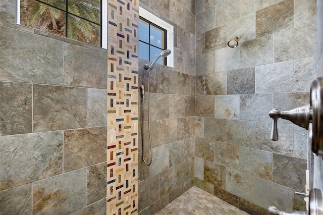 bathroom featuring tiled shower