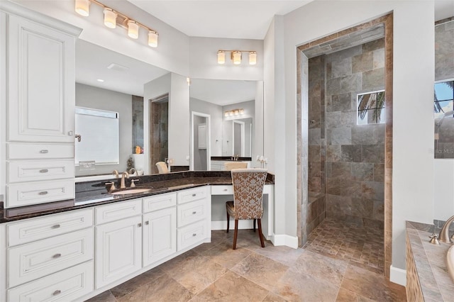 bathroom with vanity and separate shower and tub