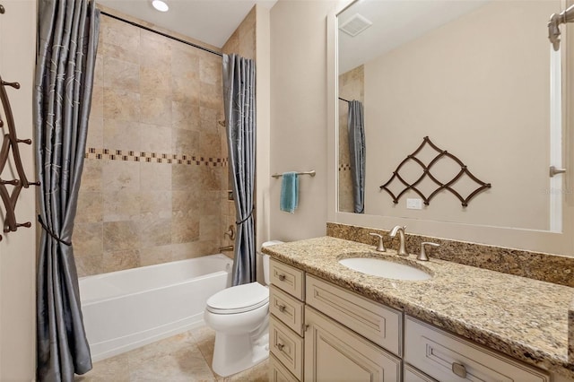 full bathroom featuring shower / bath combo with shower curtain, tile patterned flooring, vanity, and toilet