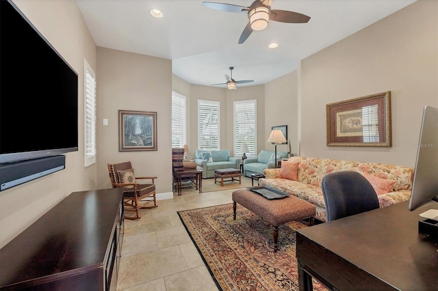 living room featuring ceiling fan and light tile patterned floors