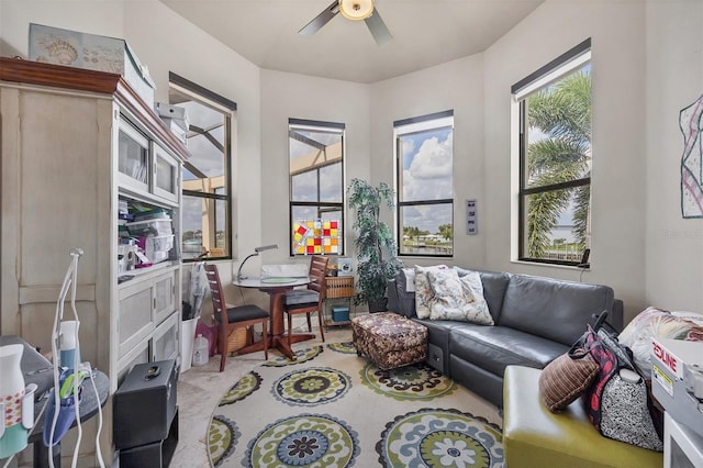 living room with ceiling fan and light colored carpet