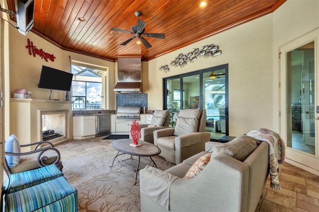 living room featuring a multi sided fireplace, ceiling fan, wooden ceiling, and crown molding