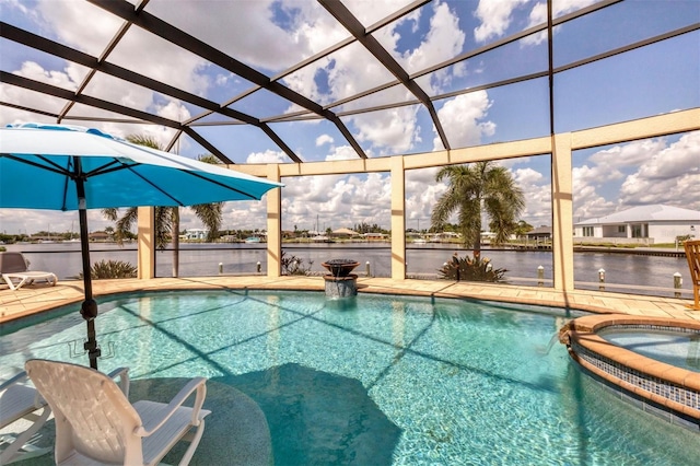 view of swimming pool with a lanai, a water view, an in ground hot tub, and a patio area