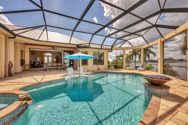 view of pool featuring a lanai, a patio, ceiling fan, and pool water feature