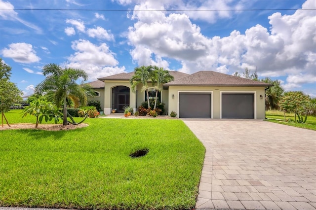 view of front of home featuring a garage and a front lawn