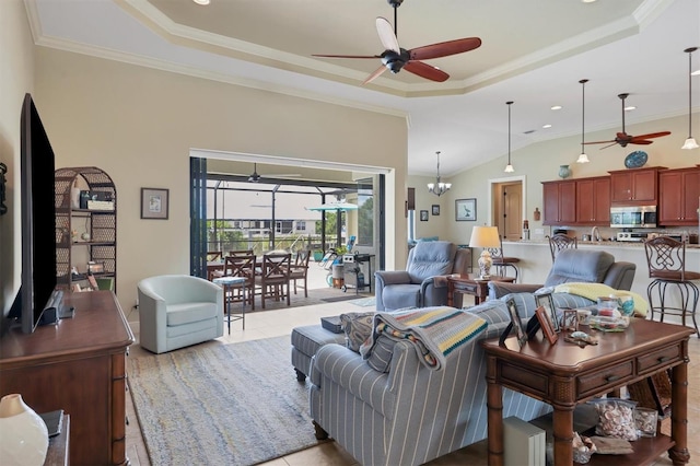 living room with ceiling fan with notable chandelier, a raised ceiling, and crown molding