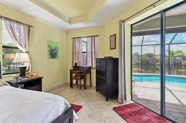 bedroom with crown molding, a raised ceiling, and access to outside