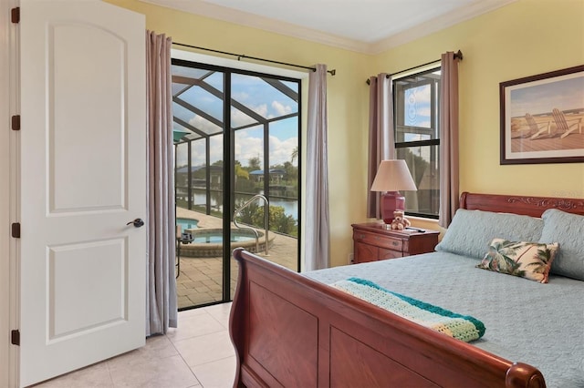 bedroom with ornamental molding, access to outside, light tile patterned floors, and a water view