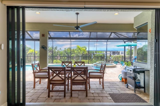 interior space featuring a water view and ceiling fan