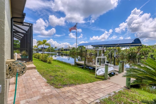 view of dock with a lanai, a lawn, and a water view