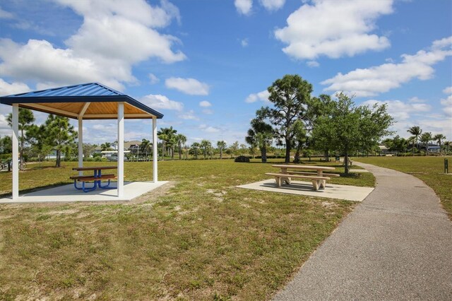 surrounding community with a yard and a gazebo