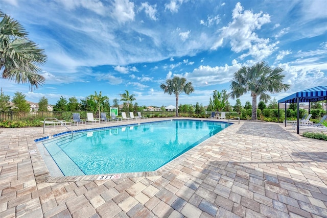 view of swimming pool featuring a patio