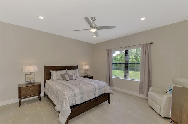 tiled bedroom featuring ceiling fan