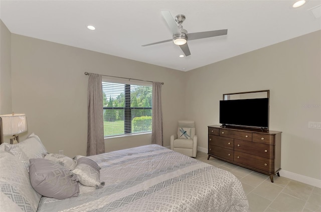 bedroom with ceiling fan and light tile patterned floors