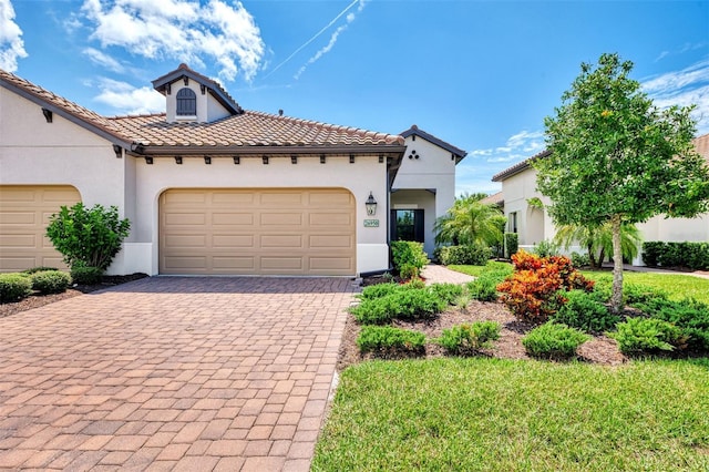 mediterranean / spanish-style home featuring a garage