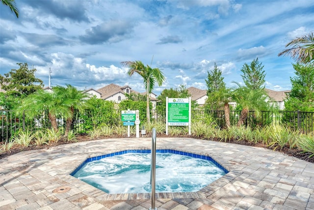 view of pool featuring a community hot tub