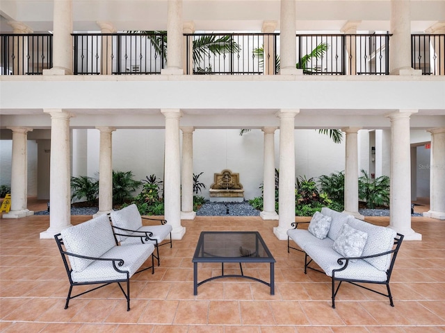 view of patio / terrace with an outdoor living space with a fireplace