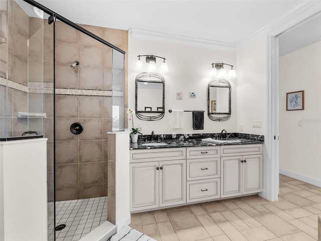 bathroom featuring vanity, crown molding, and tiled shower