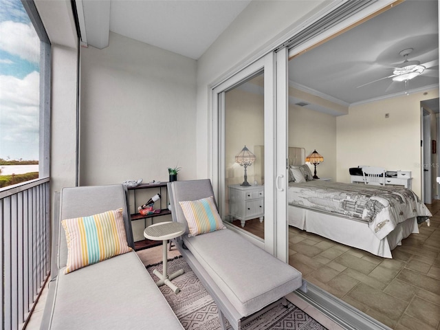 bedroom featuring ornamental molding and ceiling fan