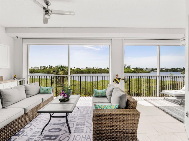 11160 Hacienda Del Mar Blvd Unit D-205, Placida, FL 33946 - sunroom / solarium featuring a water view, ceiling fan, plenty of natural light, and an outdoor hangout area