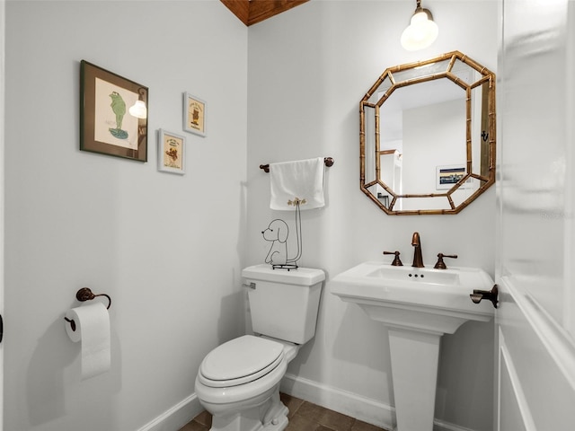 11160 Hacienda Del Mar Blvd Unit D-205, Placida, FL 33946 - half bathroom with baseboards, toilet, tile patterned floors, and a sink