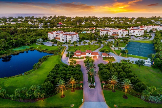 aerial view at dusk with a water view