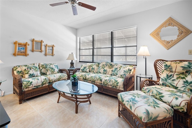 tiled living room with ceiling fan and a textured ceiling