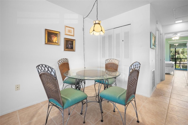 dining space featuring ceiling fan and light tile patterned floors