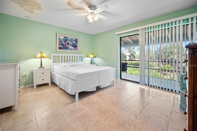 tiled bedroom with a textured ceiling, access to exterior, and ceiling fan