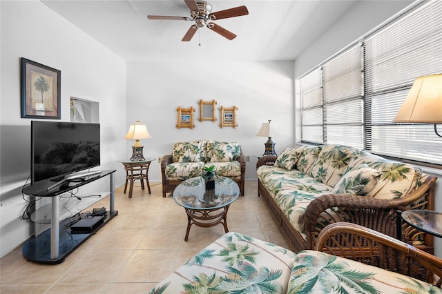8 Quails Run Blvd Unit 10, Englewood, FL 34223 - living area with light tile patterned floors, ceiling fan, and vaulted ceiling