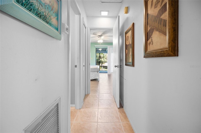 hallway featuring light tile patterned floors