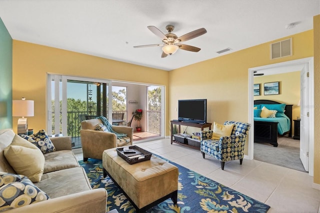 tiled living room featuring ceiling fan