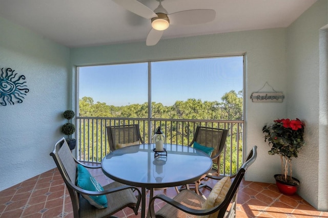 sunroom / solarium with ceiling fan and plenty of natural light