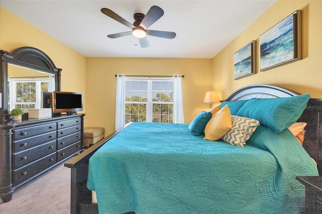 bedroom with ceiling fan and carpet flooring