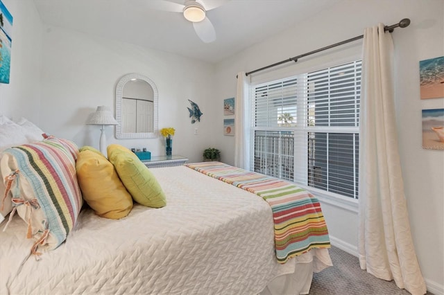 carpeted bedroom featuring ceiling fan