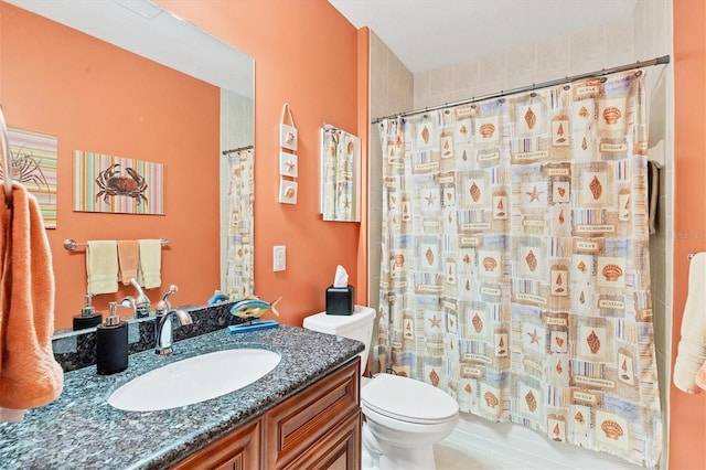 bathroom featuring a shower with curtain, vanity, and toilet