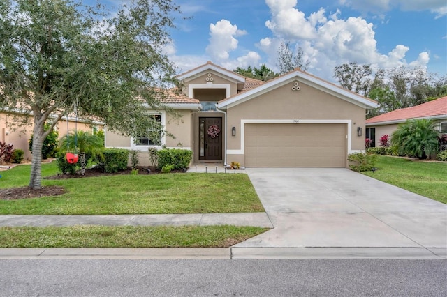 view of front of property featuring a garage and a front yard