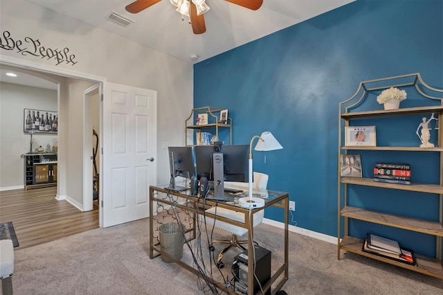 office space with ceiling fan and carpet flooring