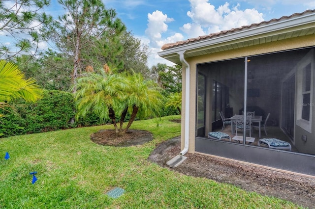 view of yard with a sunroom