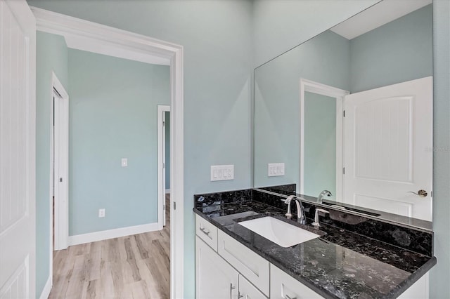 bathroom featuring wood-type flooring and vanity