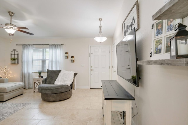 interior space featuring ceiling fan and light tile patterned flooring