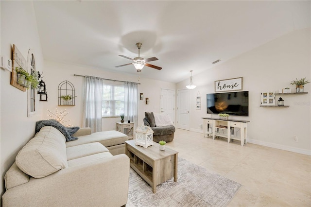 tiled living room with ceiling fan and lofted ceiling